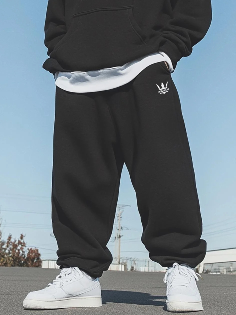Czarne dresy ze ściągaczem Jigga Wear Drawcord, krój baggy w miejskiej stylizacji